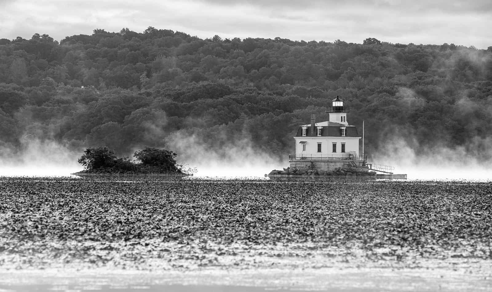 A photo of the Esopus Lighthouse on a fog covered Hudson River during a June morning.